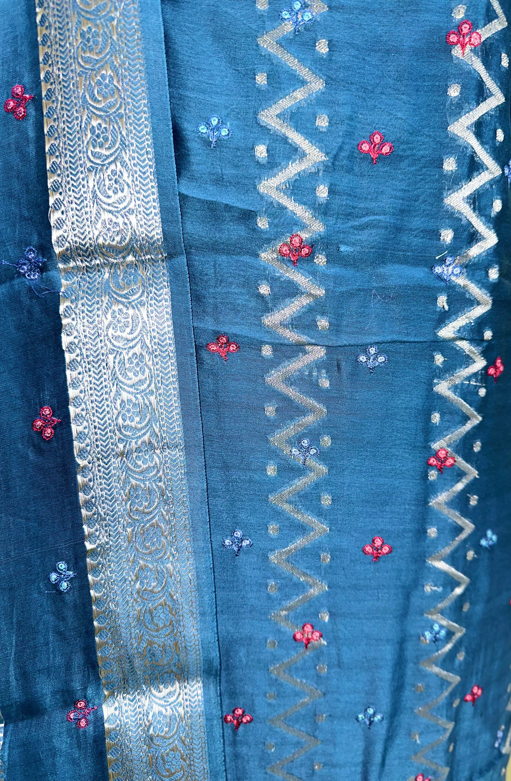 Teal Blue Maheshwari Silk Featuring Intricate Floral Embroidery and Silver Zigzag Thread Work Unstitched Suit