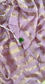 Purple Mal Chanderi Features Intricate Embroidery Depicting a Peacock and Floral Motifs, Characteristic of a Premium Indian Unstitched Suit