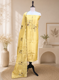 Yellow Kora Adorned with Intricate Embroidered Motifs Including a Bird and Floral Patterns, Commonly Crafted Using Techniques Like Zardosi and Kantha Work Unstitched Suit