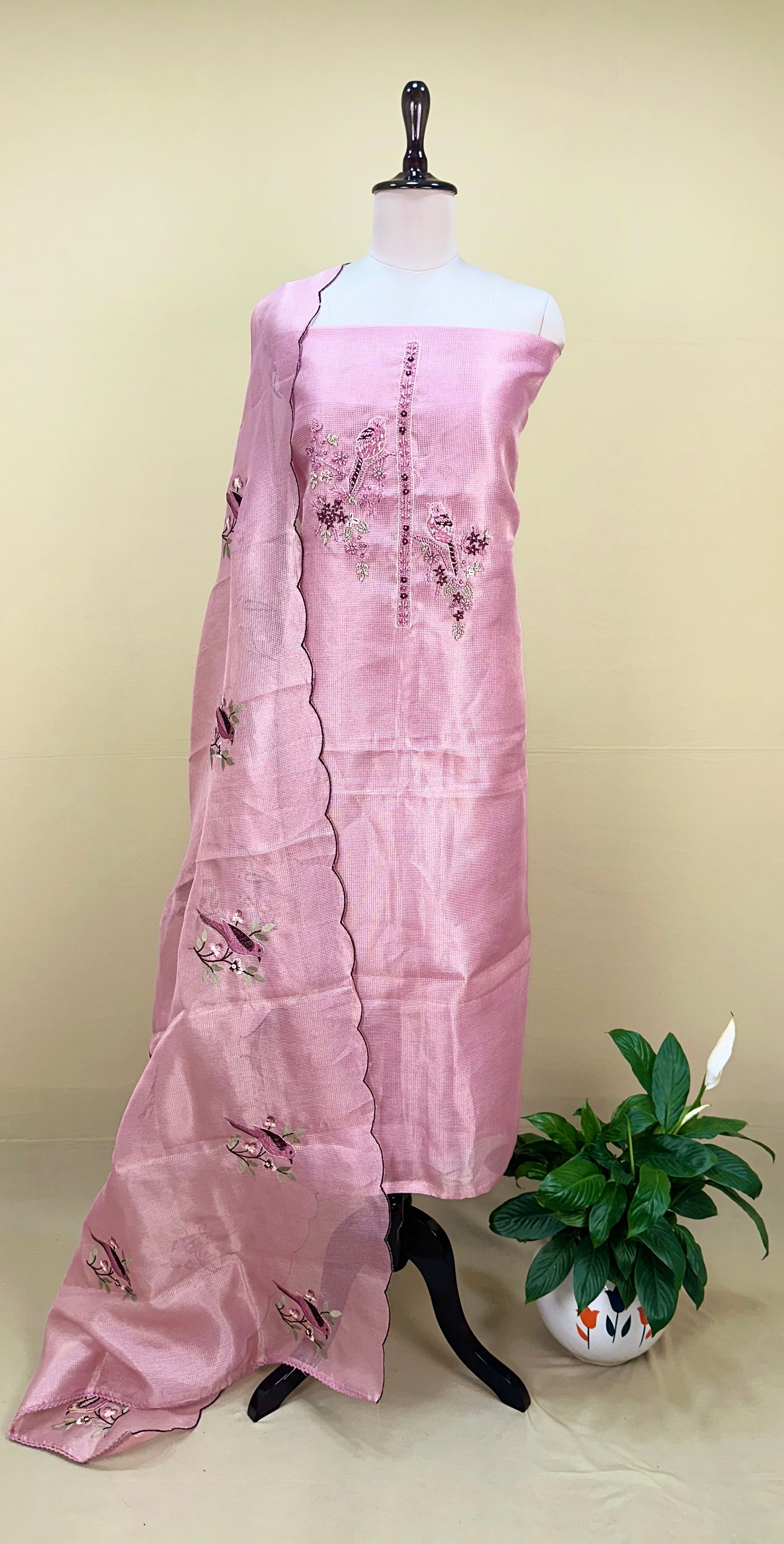Pink Kora Adorned with Intricate Embroidered Motifs Including a Bird and Floral Patterns, Commonly Crafted Using Techniques Like Zardosi and Kantha Work Unstitched Suit