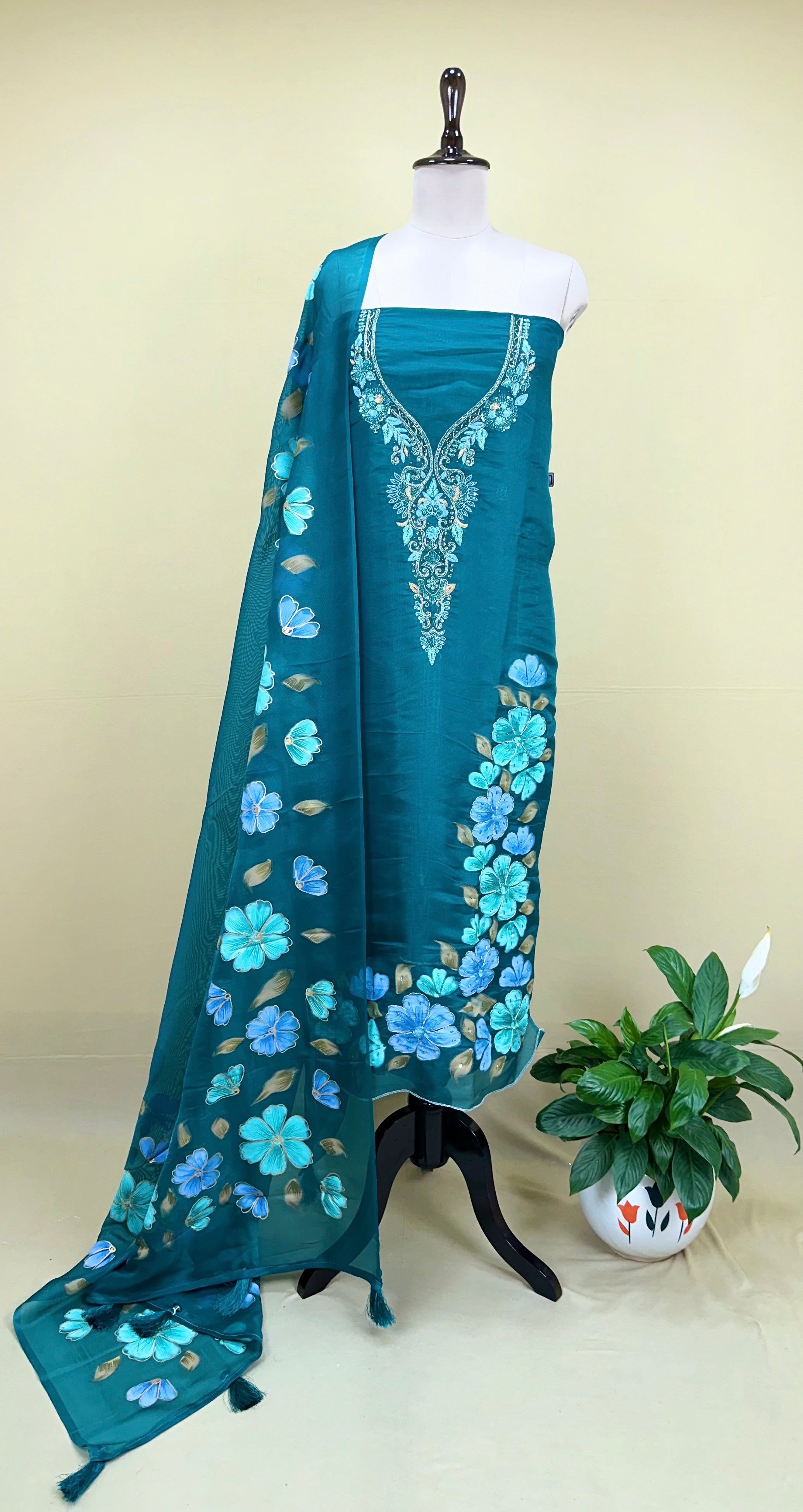 Green Organza Featuring Elegant Hand-Painted Floral Designs Combined with Hand Embroidery Detailing Unstitched Suit